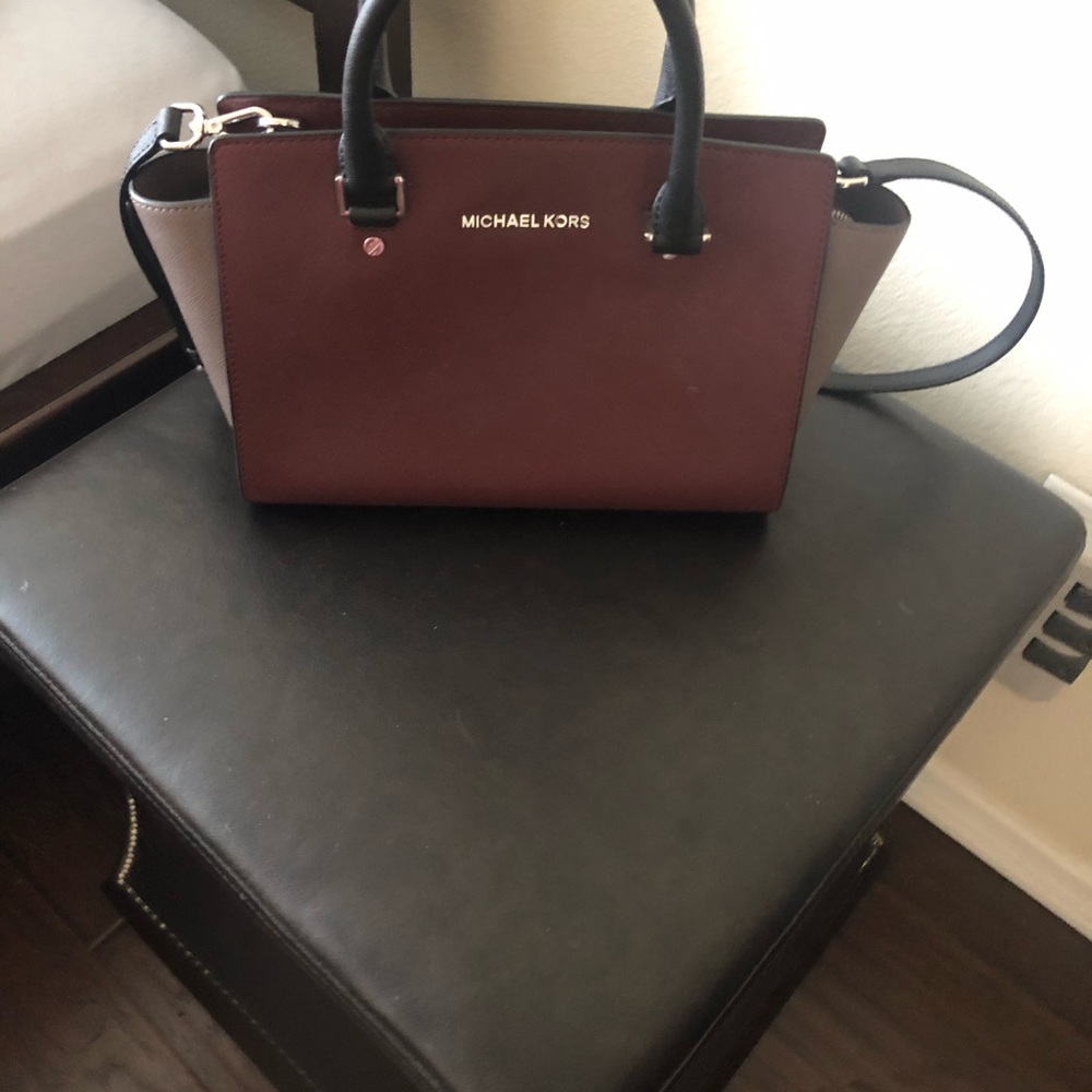Michael kors maroon purse.